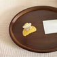 Beau hair clip held in hand displaying size and floral acetate material