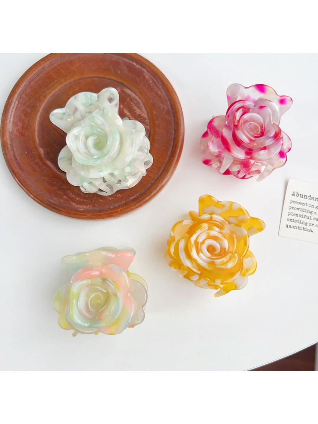 Close-up of Beau flower-shaped claw clip showing smooth matte finish and petal design