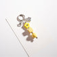 Keypus beaded star keychain hanging from a backpack zipper pull