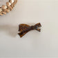 Beau hair clip held in hand showing size and shape