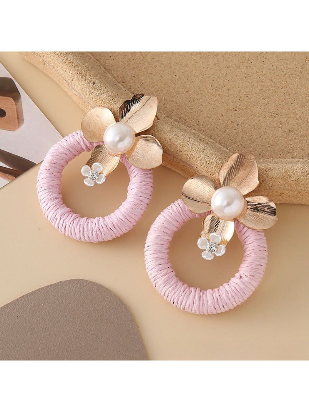 Earedge round floral pendant earrings shown with matching necklace on display
