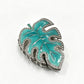 Beau leaf shaped hair clip displayed with matching accessories