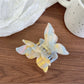 Butterfly claw clip in pastel pink with glossy finish