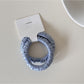 Gifty satin hair tie packaged in minimalist branded box with logo