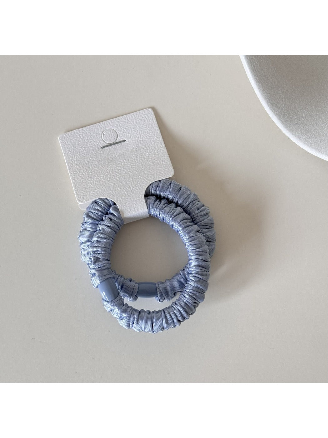 Gifty satin hair tie packaged in minimalist branded box with logo