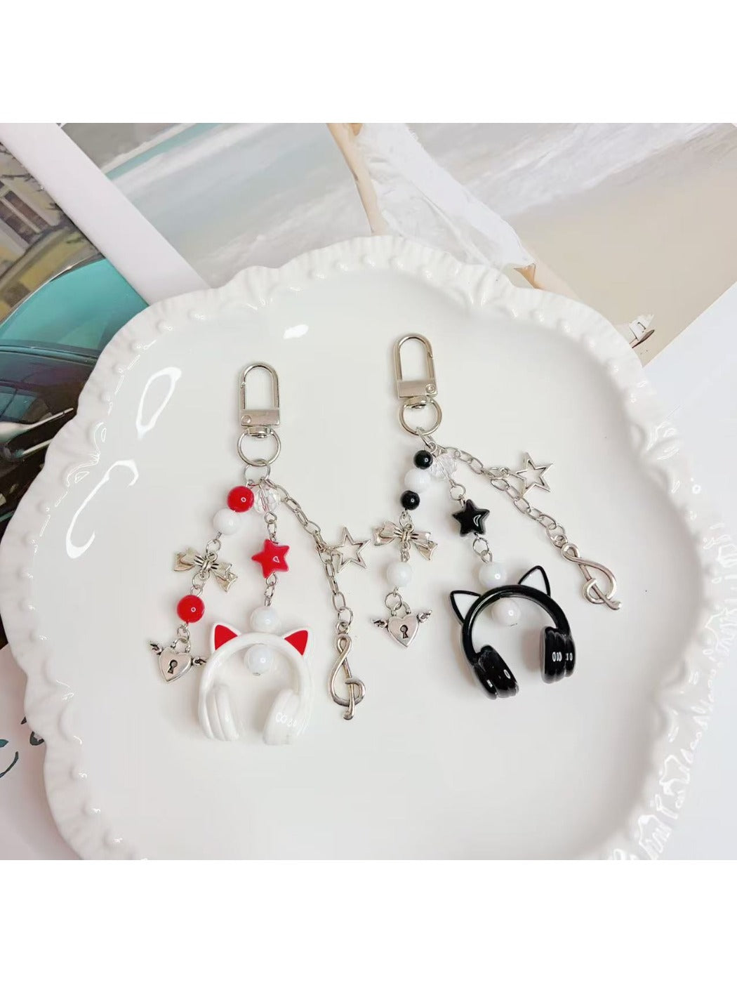 Close-up of the headphone pendant keychain showing detailed ear cup design