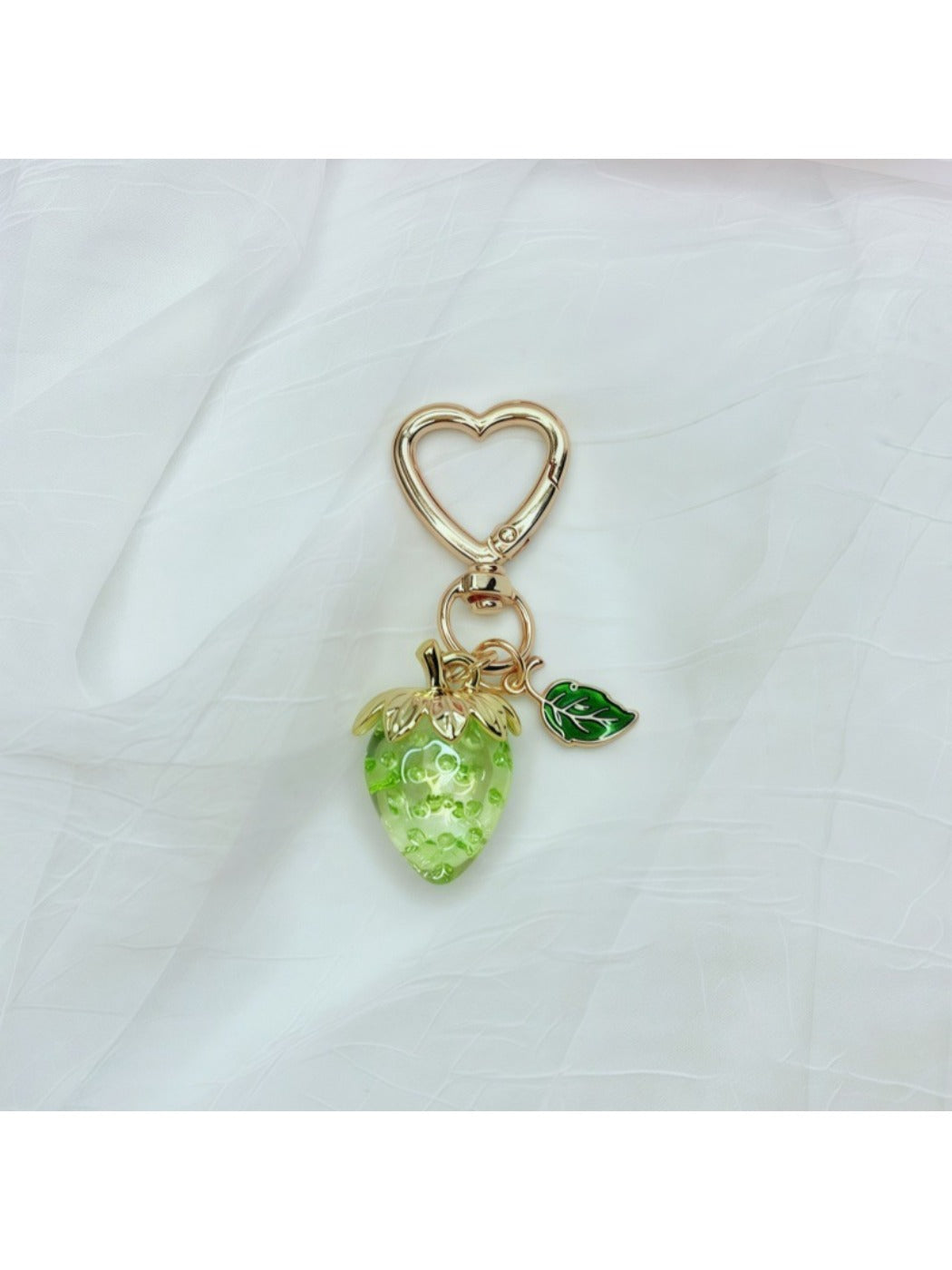 Side view of Keypus strawberry charm keychain highlighting the metal ring
