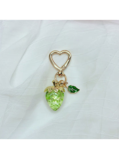Side view of Keypus strawberry charm keychain highlighting the metal ring