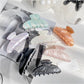 Beau elegant pearlescent claw clip on white background showing full clip