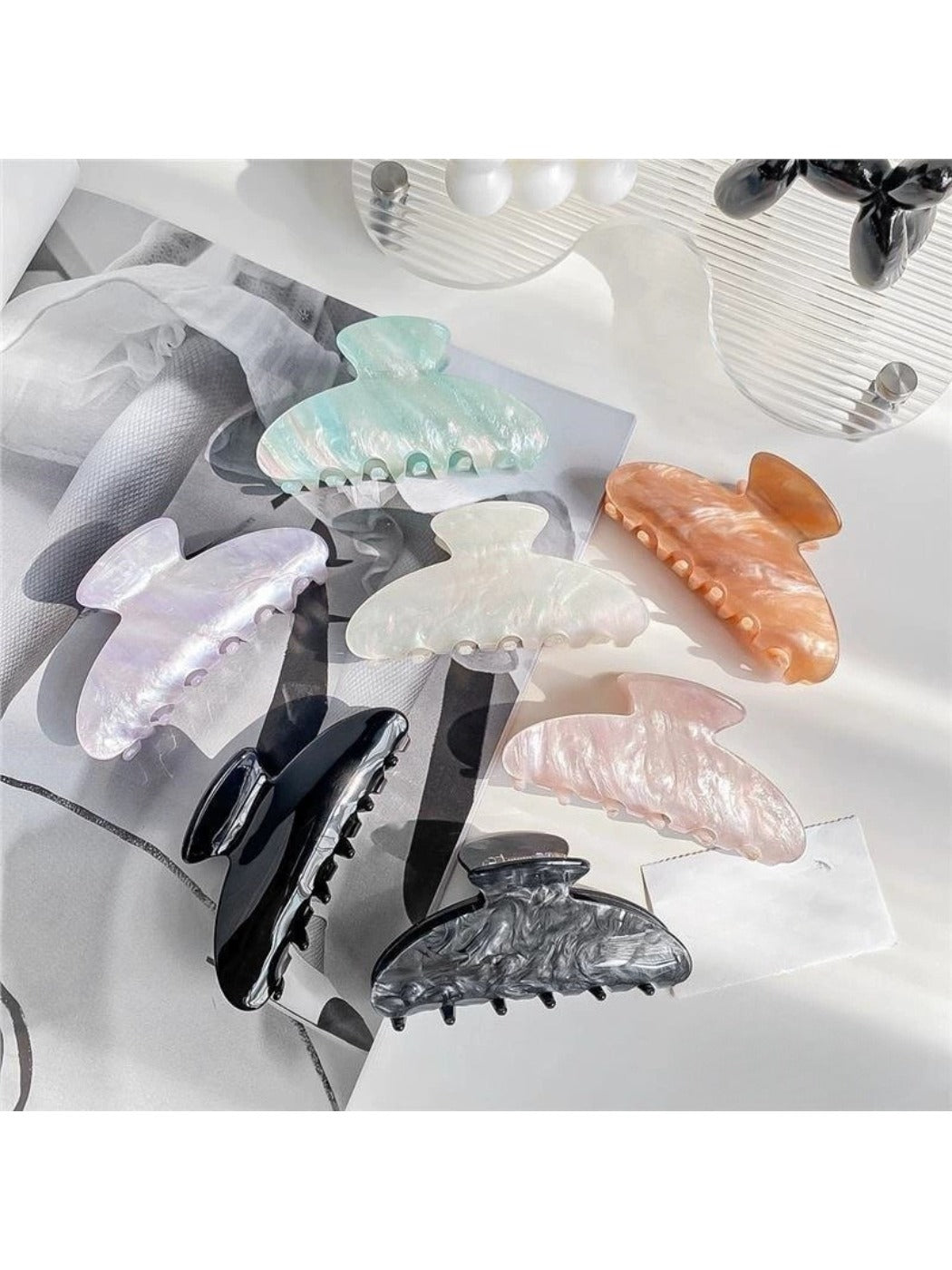Beau elegant pearlescent claw clip on white background showing full clip