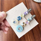 Close-up of Beau sweet colorful rhinestone hair clip with multicolored gems on gold base
