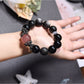 Lovra black crystal beaded bracelet worn on a wrist with a neutral background