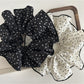 Side view of Gifty fabric scrunchie with small flowers on fabric