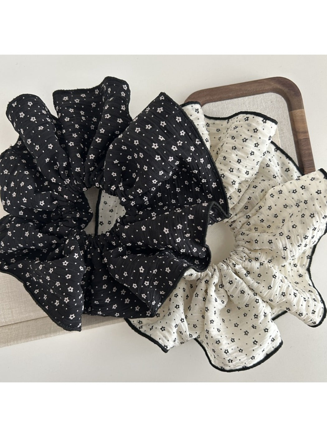 Side view of Gifty fabric scrunchie with small flowers on fabric