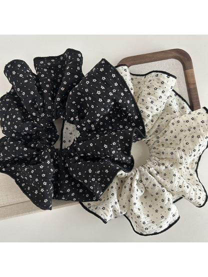 Side view of Gifty fabric scrunchie with small flowers on fabric