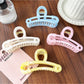 Beau hollow paperclip shape claw clip in gold metal on white background