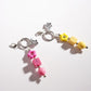 Keypus star-shaped keychain hanging from a silver keyring on a white background