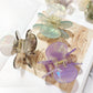 Side view of Beau Sweet Acetate Medium Flower Claw Clip highlighting curved shape