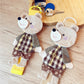 Back view of the patchwork bear keychain displaying multicolored fabric pieces
