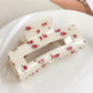 Beau floral print square hair claw clip worn in long hair from back