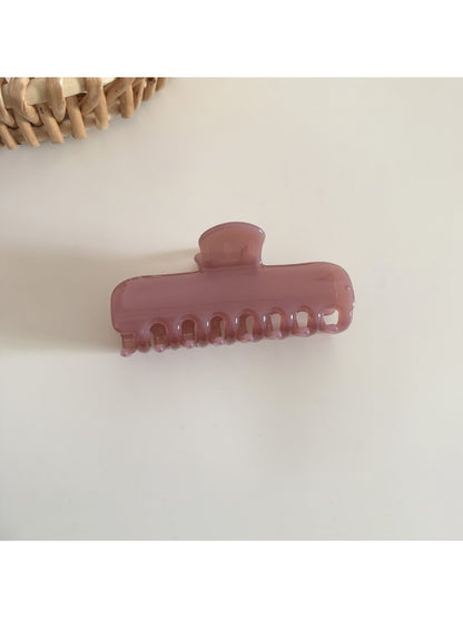 Beau pastel purple rectangular hair clip with metal clasp on white surface