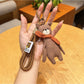 Top view of the bear keychain highlighting the scarf and ears