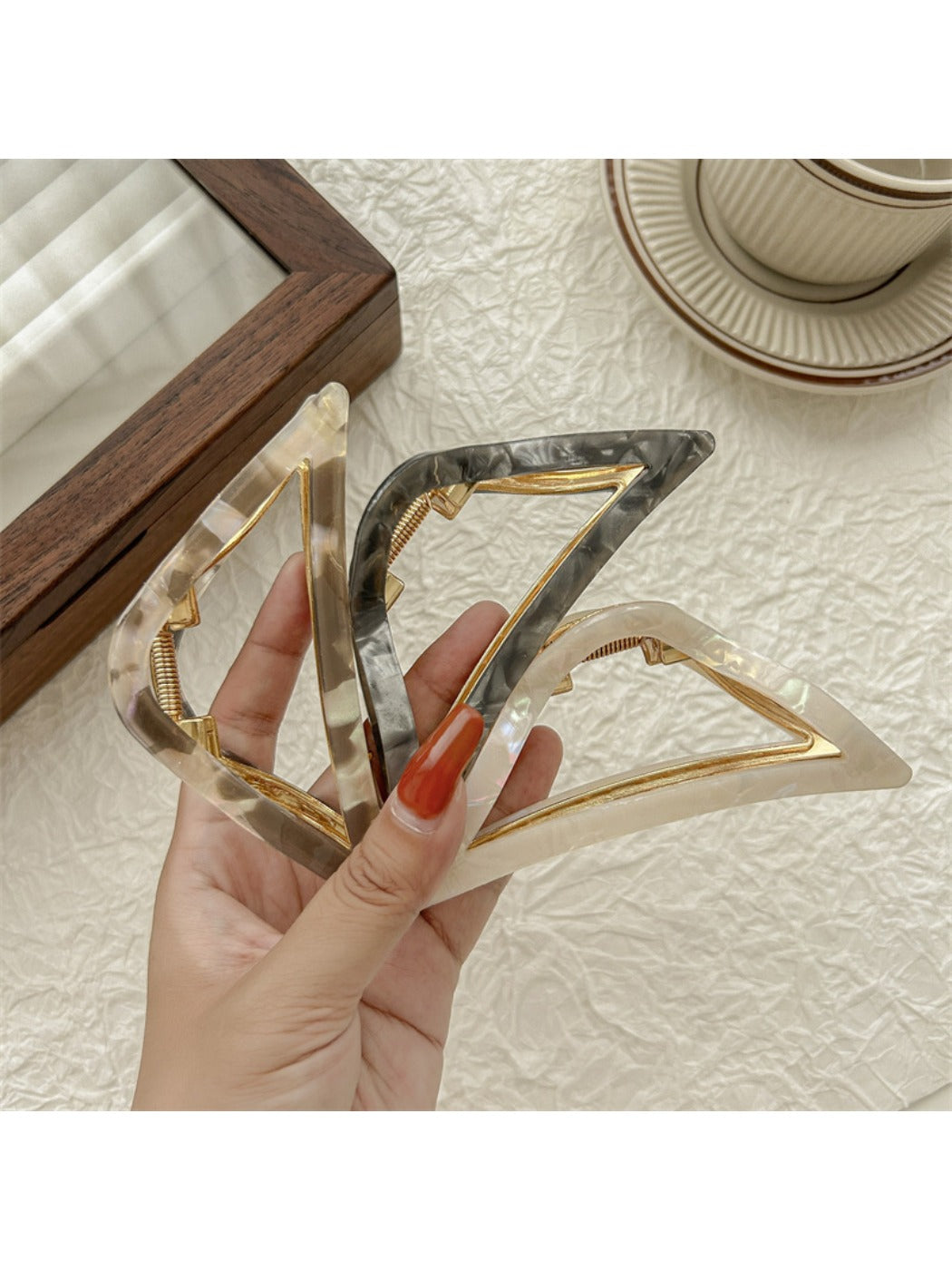 Beau triangle claw clip in matte black, angled top view