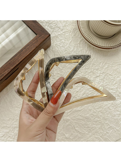 Beau triangle claw clip in matte black, angled top view