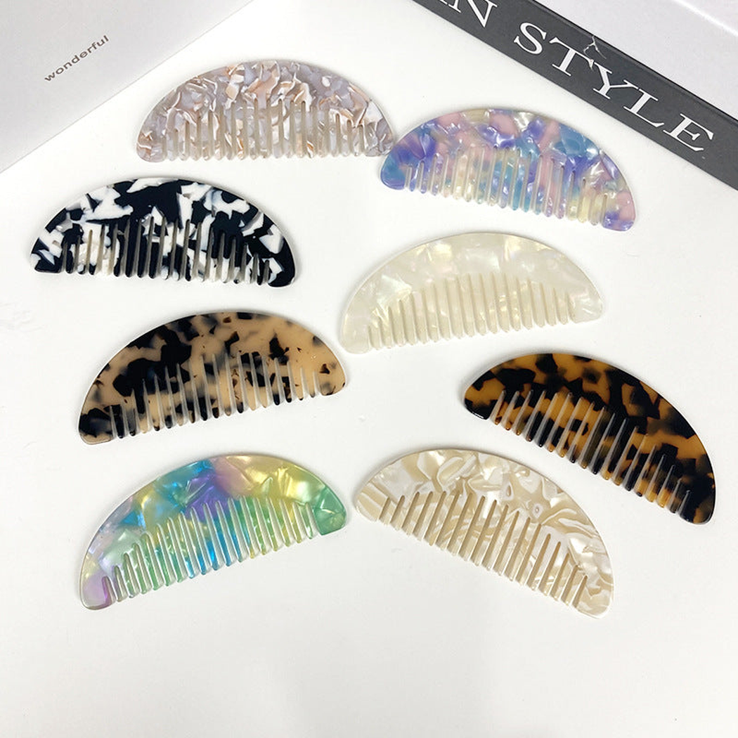 Eight geometric veined pocket combs in assorted color patterns, variant overview