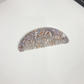 Gray and purple veined pocket comb, front view