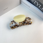 Cream and brown mottled hair claw, front view