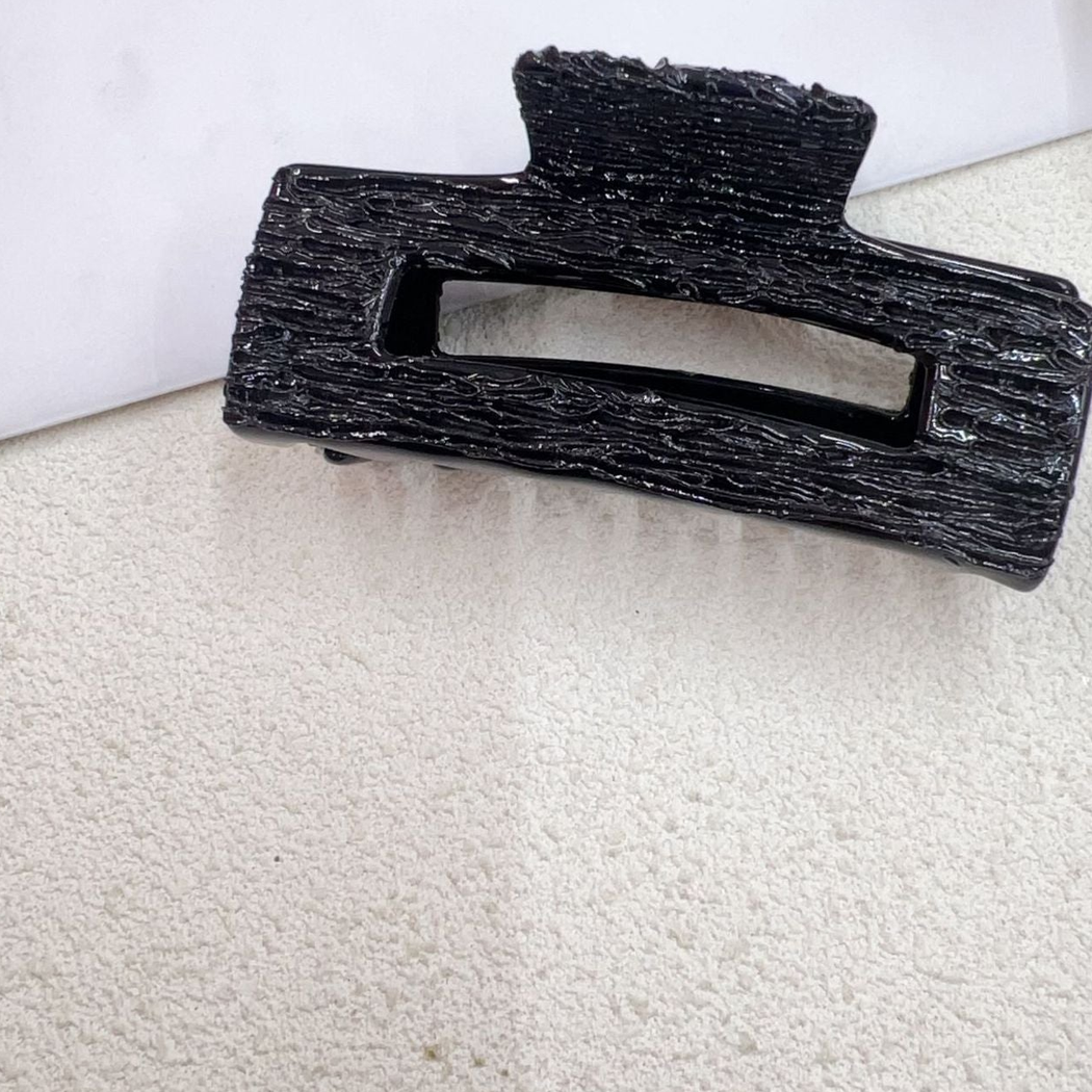 Black textured rectangular open-center hair claw clip