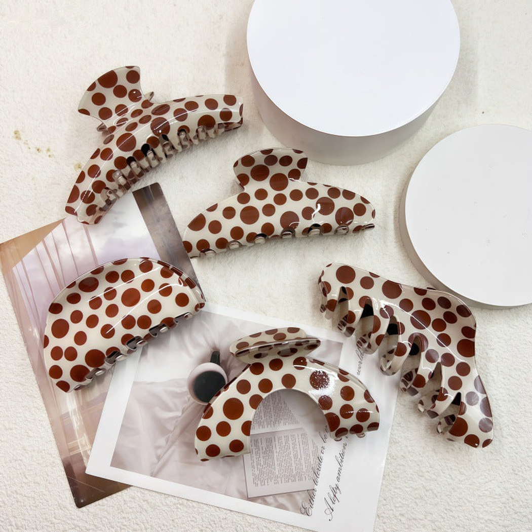 Overview of five polka dot geometric hair claw clip styles