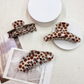 Polka dot hair claw clips shown from front and reverse angles
