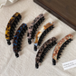 Beau - Curved Marbled Banana Hair Clip