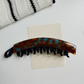 Beau - Elongated Curved Mottled Pattern Banana Clip