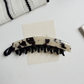 Beau - Elongated Curved Mottled Pattern Banana Clip