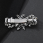 Beau - Floral Bow-Accent Spring Hair Clip
