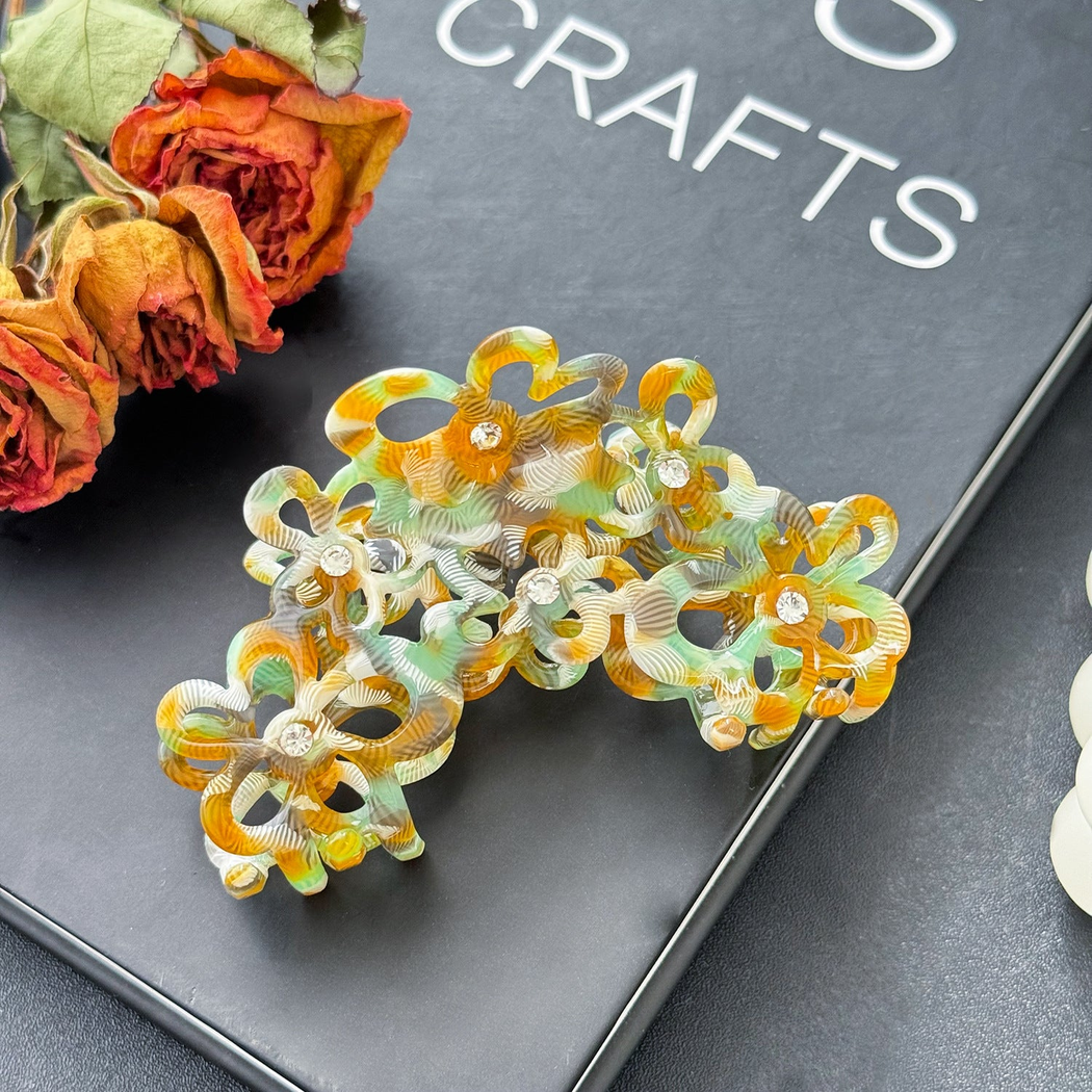 Beau - Openwork Flower Cluster Swirled Pattern Claw Clip