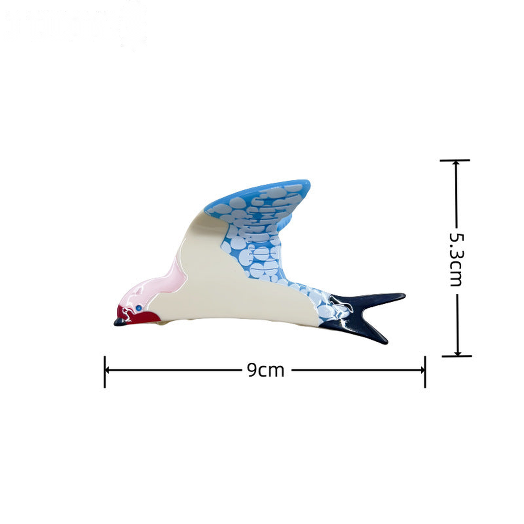 Swallow-shaped acetate hair claw clip with 9 cm by 5.3 cm dimensions
