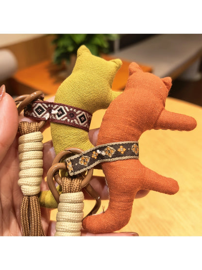 Side view of fox charm keychain showing metal ring attachment