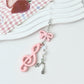 Keypus music note keychain displayed with other colorful keychains
