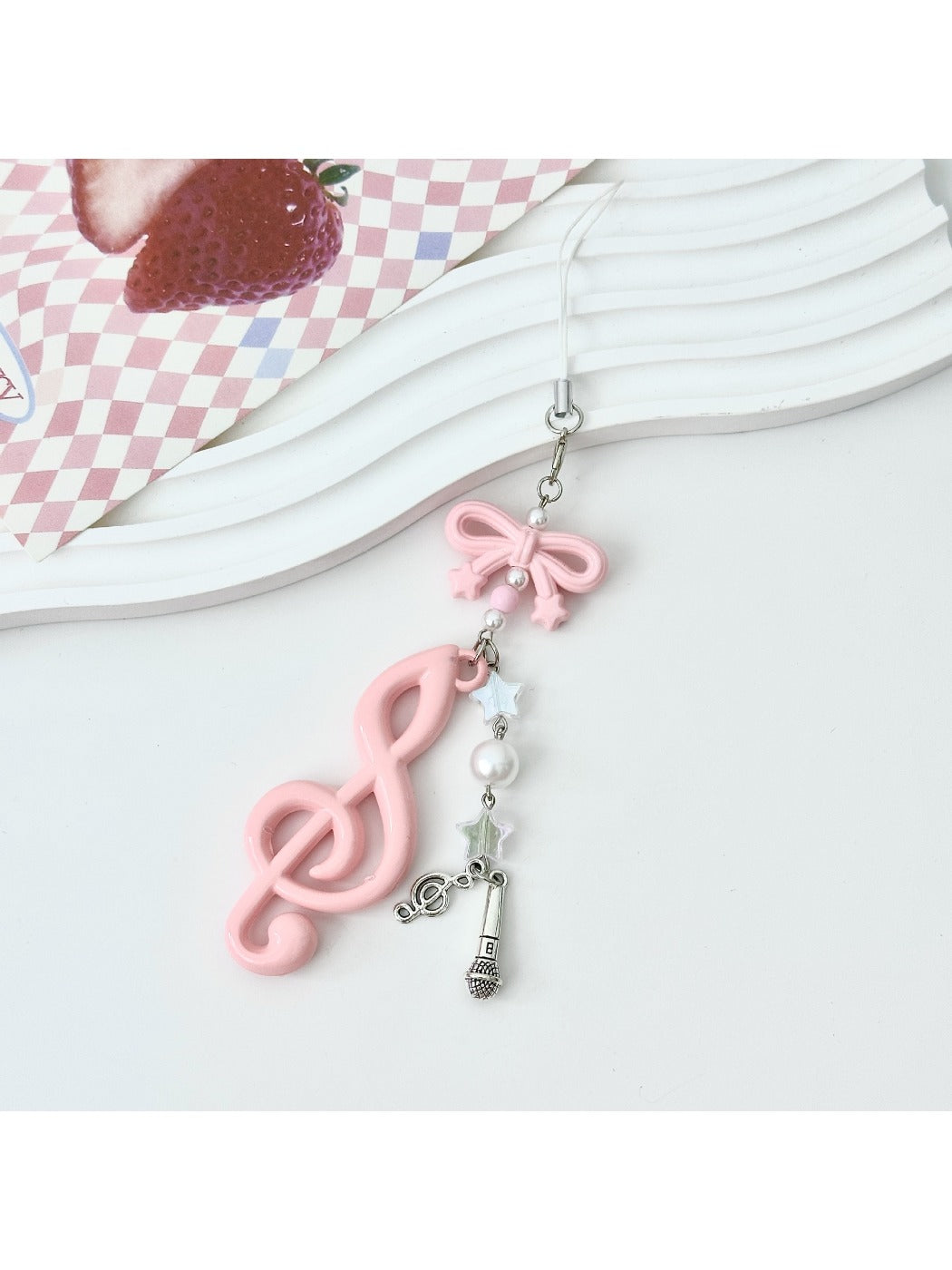 Keypus music note keychain displayed with other colorful keychains