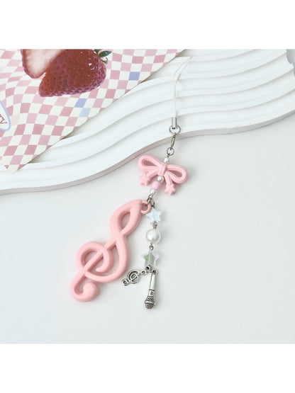 Keypus music note keychain displayed with other colorful keychains