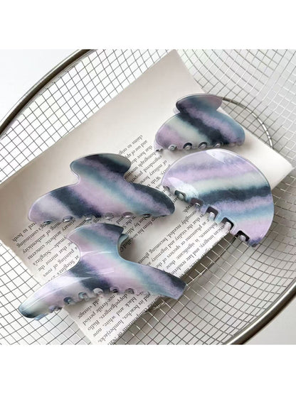 Beau elegant purple toned hair claw clip on white background
