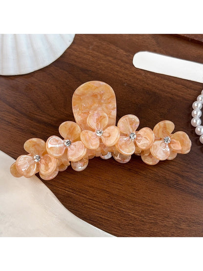 Beau elegant floral half round claw clip photographed with soft lighting