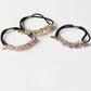 Gifty beaded hair tie displayed on a white background showing round and faceted beads