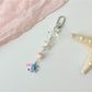 Yellow fish keychain displayed alongside other colored fish keychains