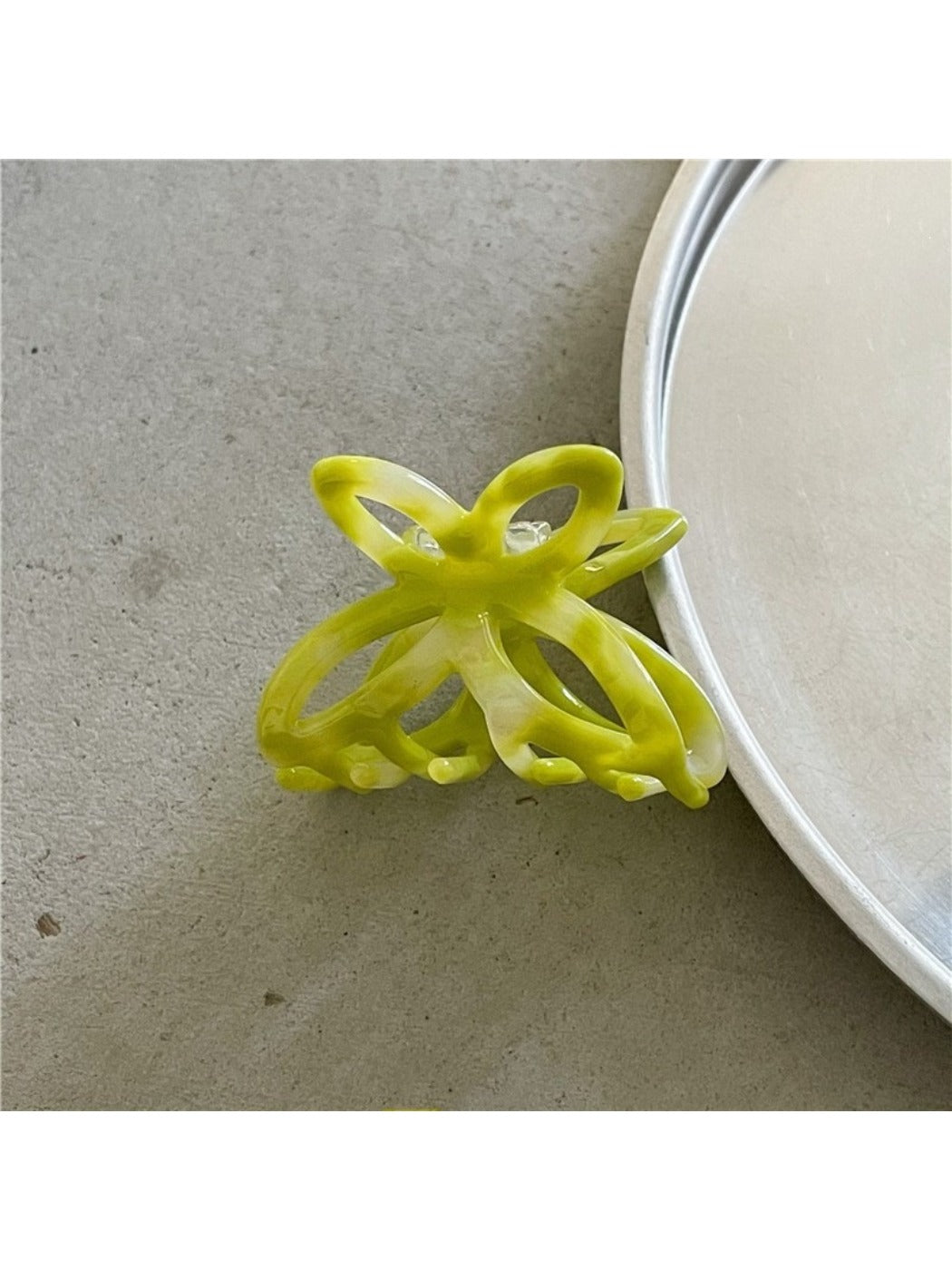 Beau Misty Acetate Butterfly Hair Clip displayed with other hair accessories