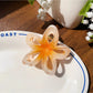 Beau classic hair claw clip in beige with floral cutout pattern